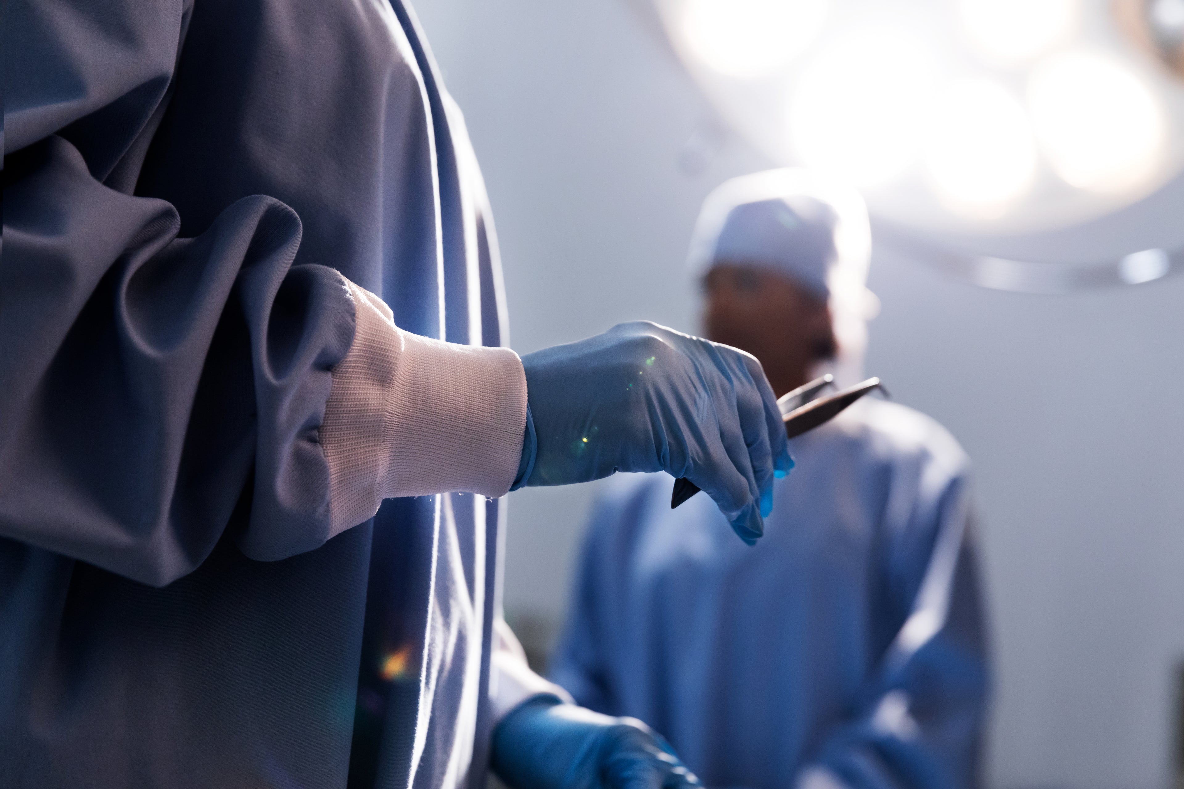 Medical professional handling disposable gloves